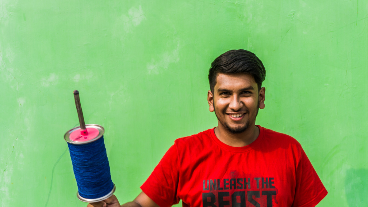 Young man with firki and pipuda for Makar Sankranti festival